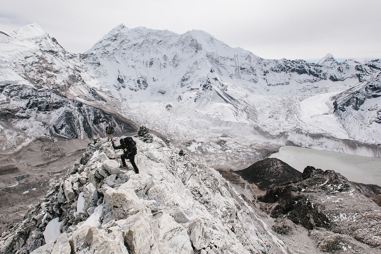 Climber hiking icy glacier